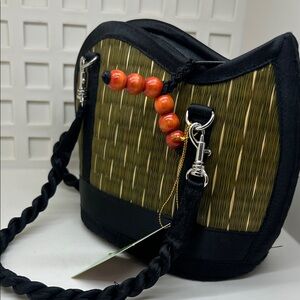 Woven Straw Shoulder Bag with Black Trim and Orange Bead Accent